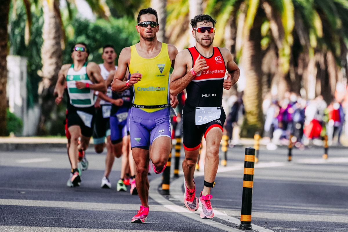 Group of runners competing in a road race wearing compression gear for endurance support