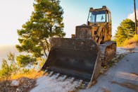 Yellow and Black Front Loader on Roadside