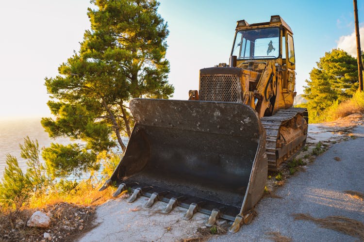 Yellow And Black Front Loader On Roadside