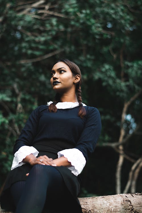 Low Angle View of Woman in Dress and Dark Lipstick