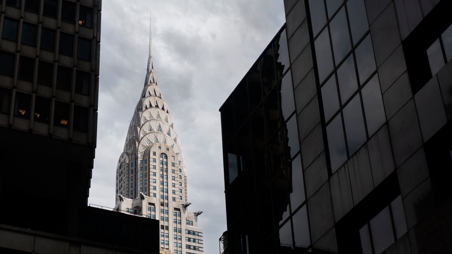 The iconic Chrysler Building surrounded by other skyscrapers in New York City.