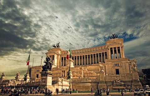 Stunning view of the Victor Emmanuel II Monument in Rome under dramatic skies.