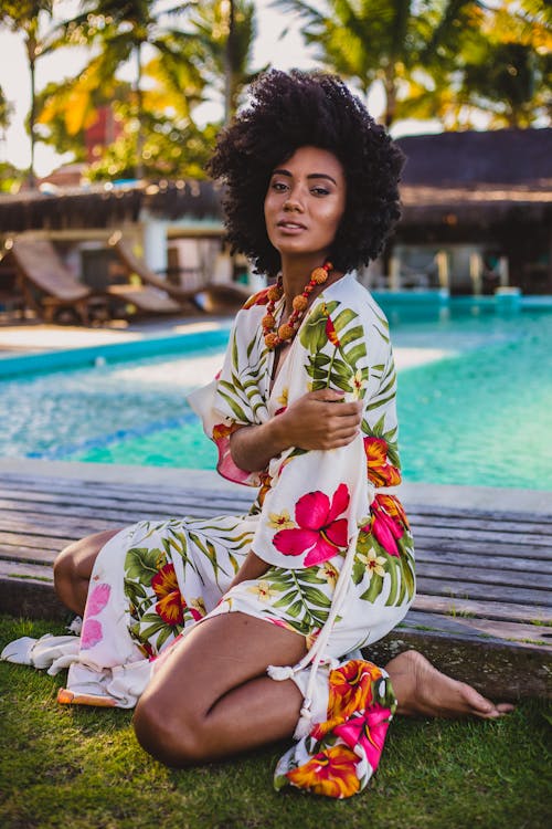 Stylish African American model in ornamental wear on lawn Free