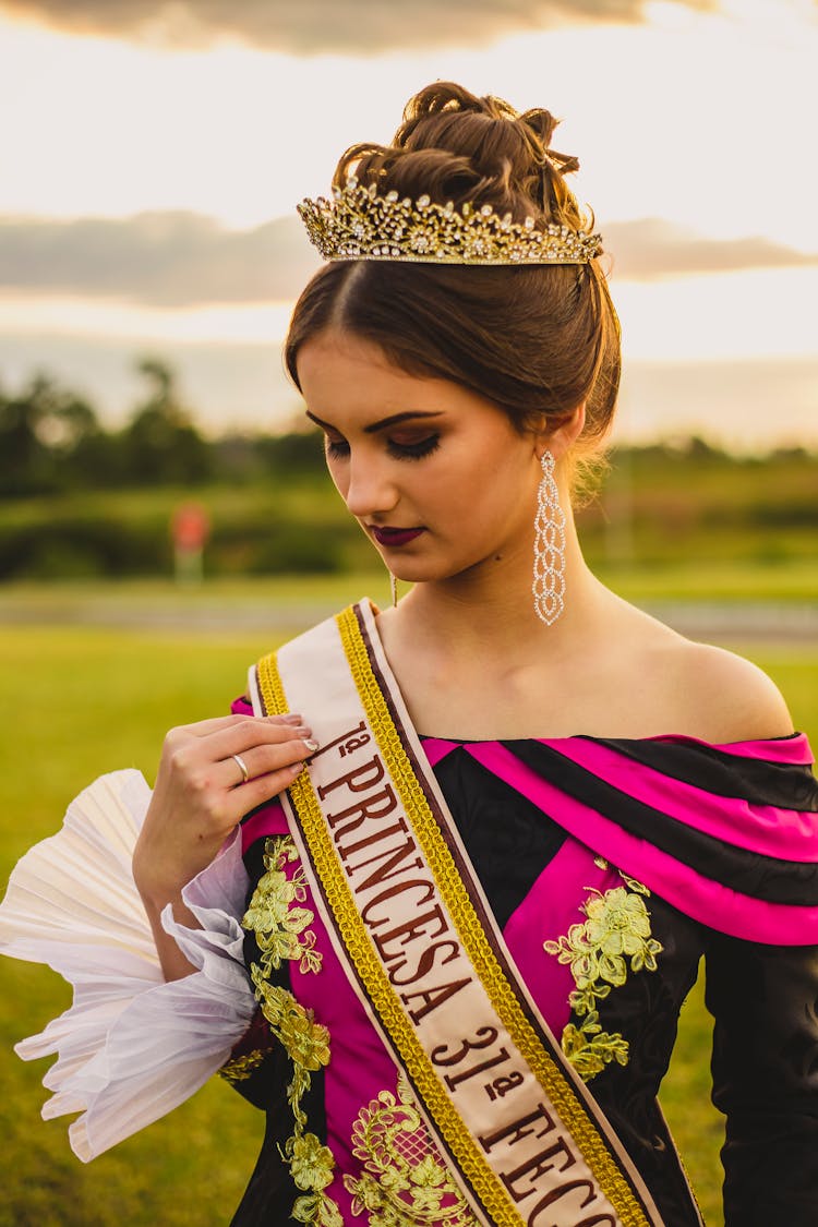 Stylish Beauty Contest Winner In Crown And Ribbon In Countryside