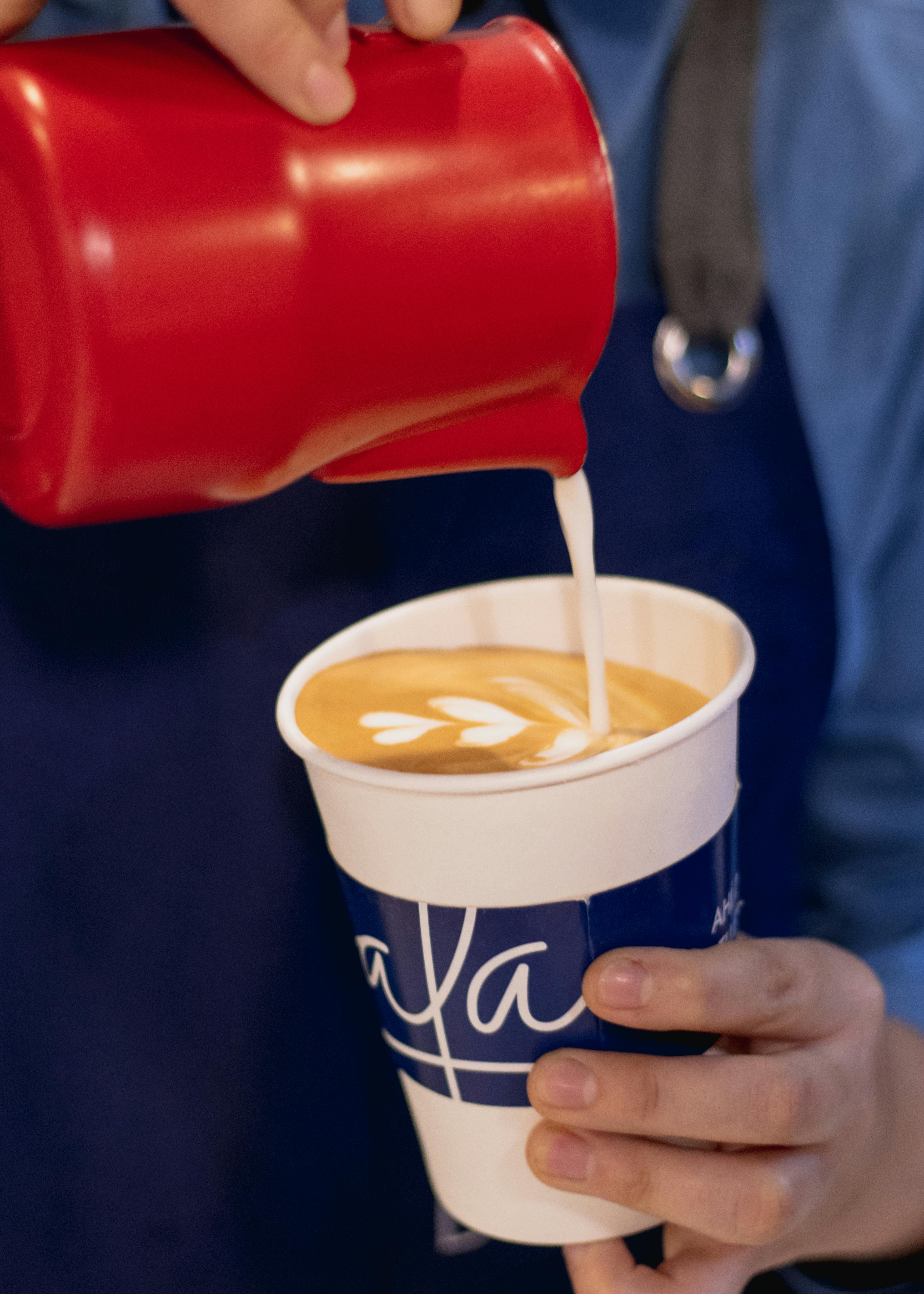 coffee foam in a disposable cup Stock Photo