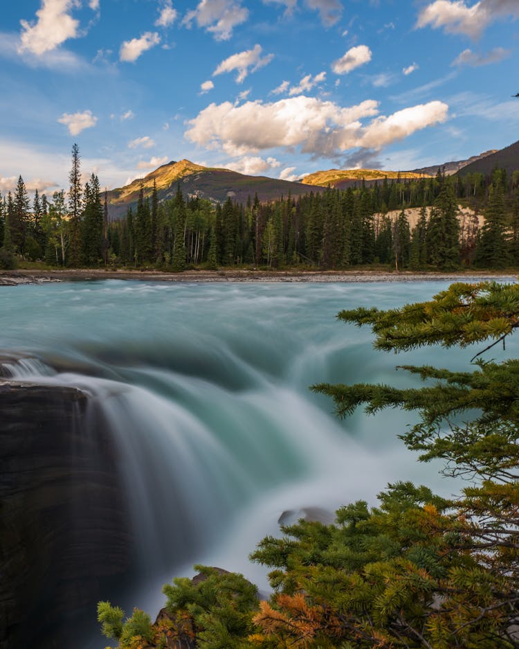 Cascading Waterfall Under Blue Sky