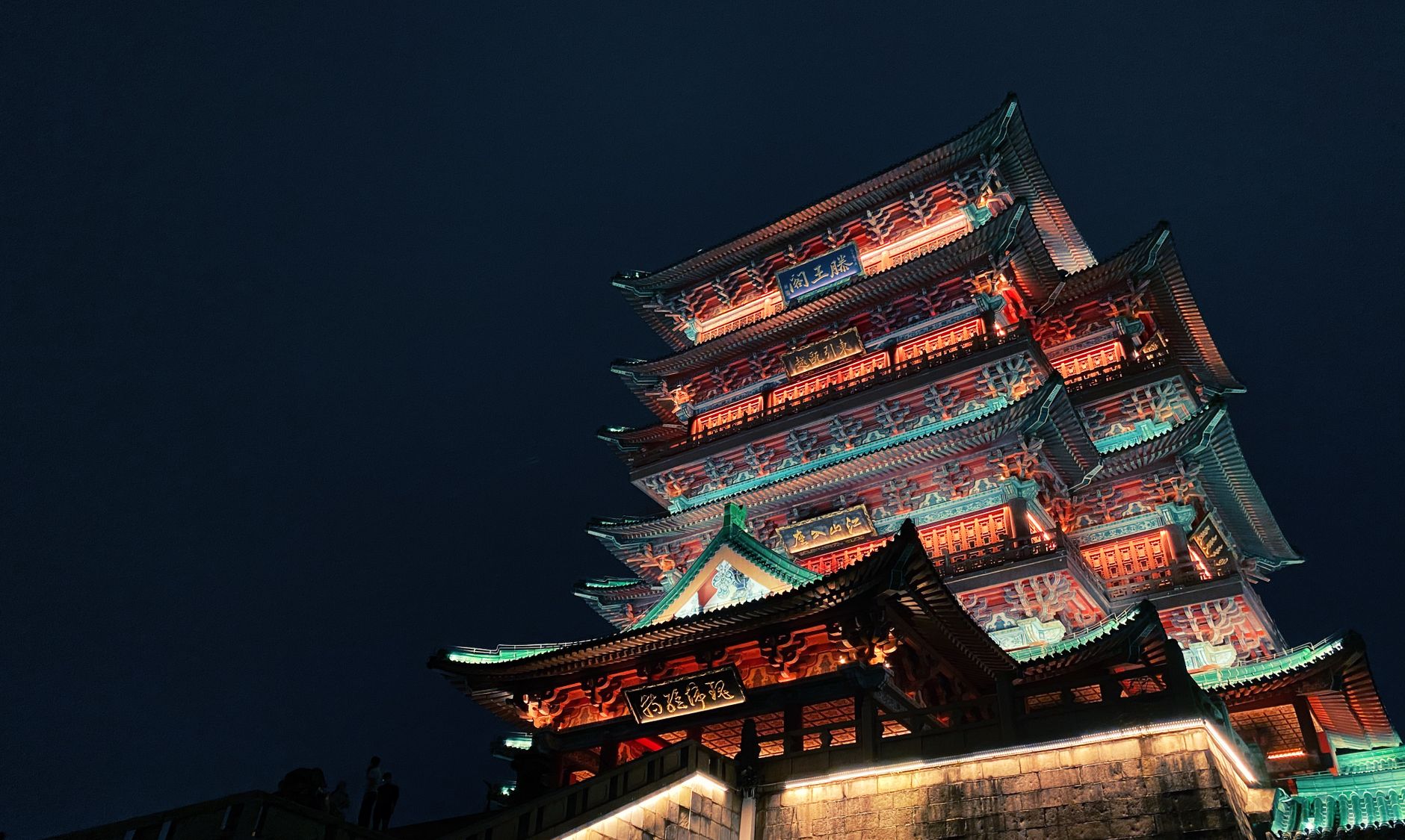 Stunning view of illuminated Chinese pavilion at night in Nanchang, showcasing traditional architecture.
