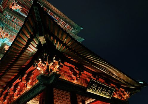 A stunning view of a traditional Chinese pagoda in Nanchang illuminated against a dark night sky.