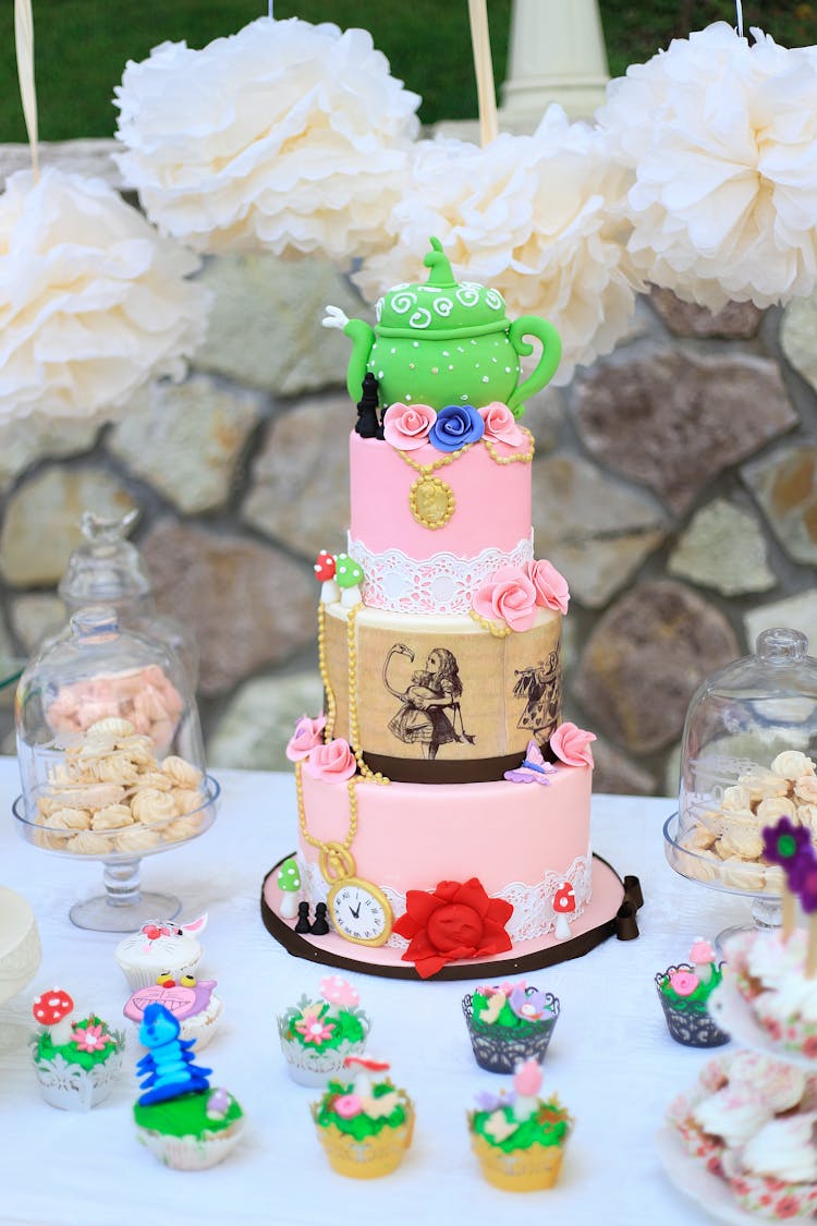 Green Teapot Design On Top Of Cake