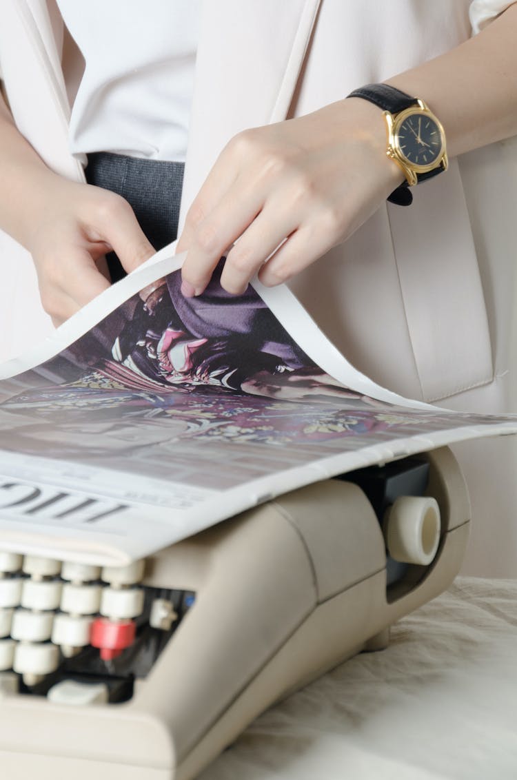 Hand Holding White Printed  Paper