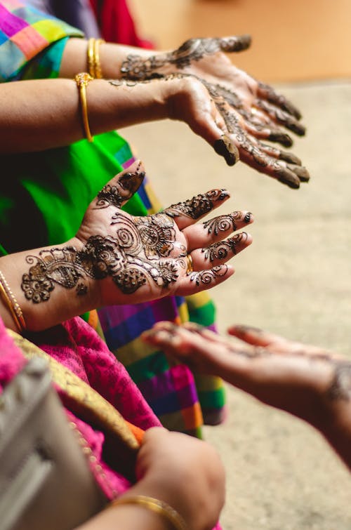 Mehndi Painted on Women's Hands