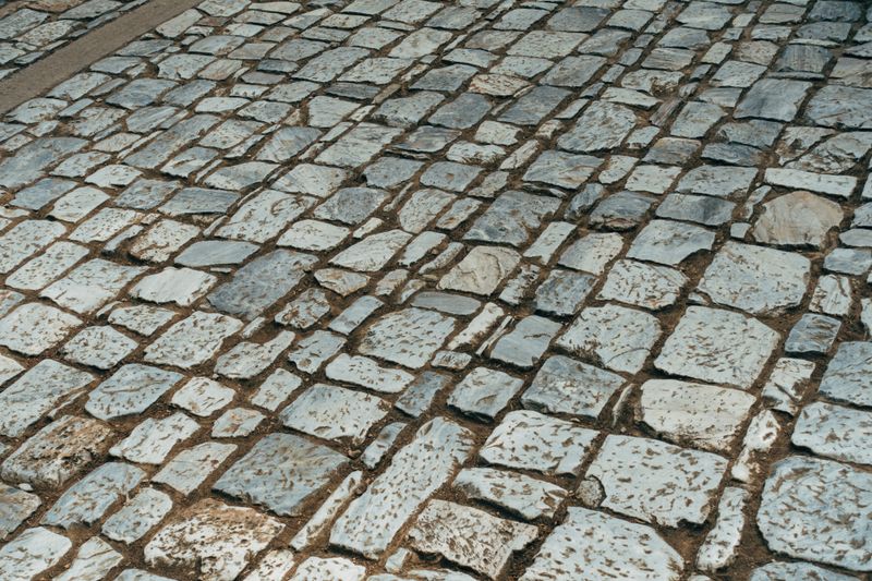 Close-up of granite block setts laid in a fan pattern
