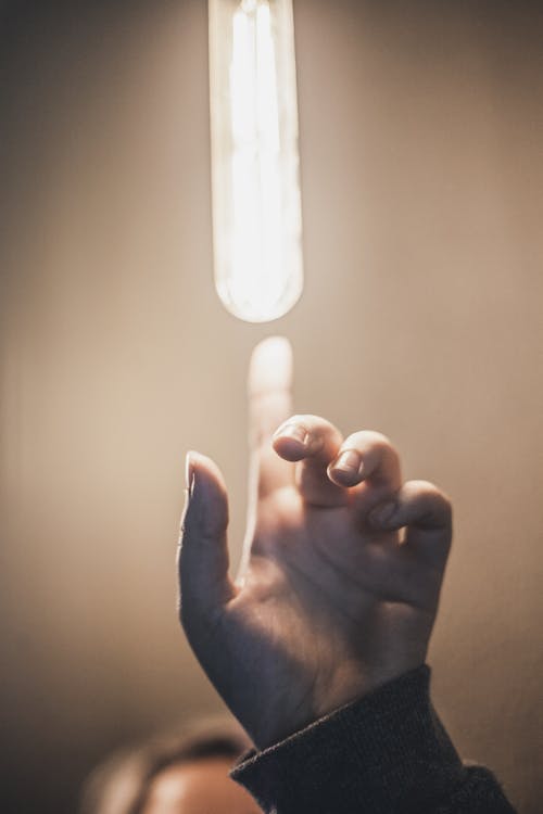 Touching Light Bulb with Index Finger