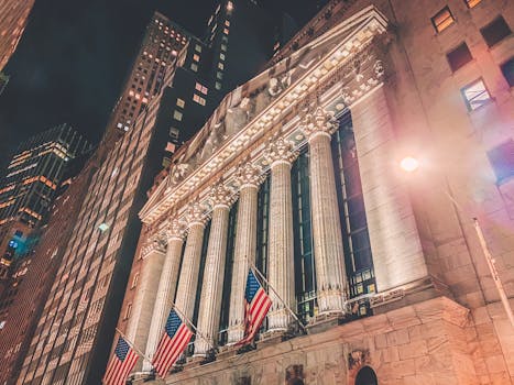 A striking night view of the New York Stock Exchange's illuminated facade in Manhattan.