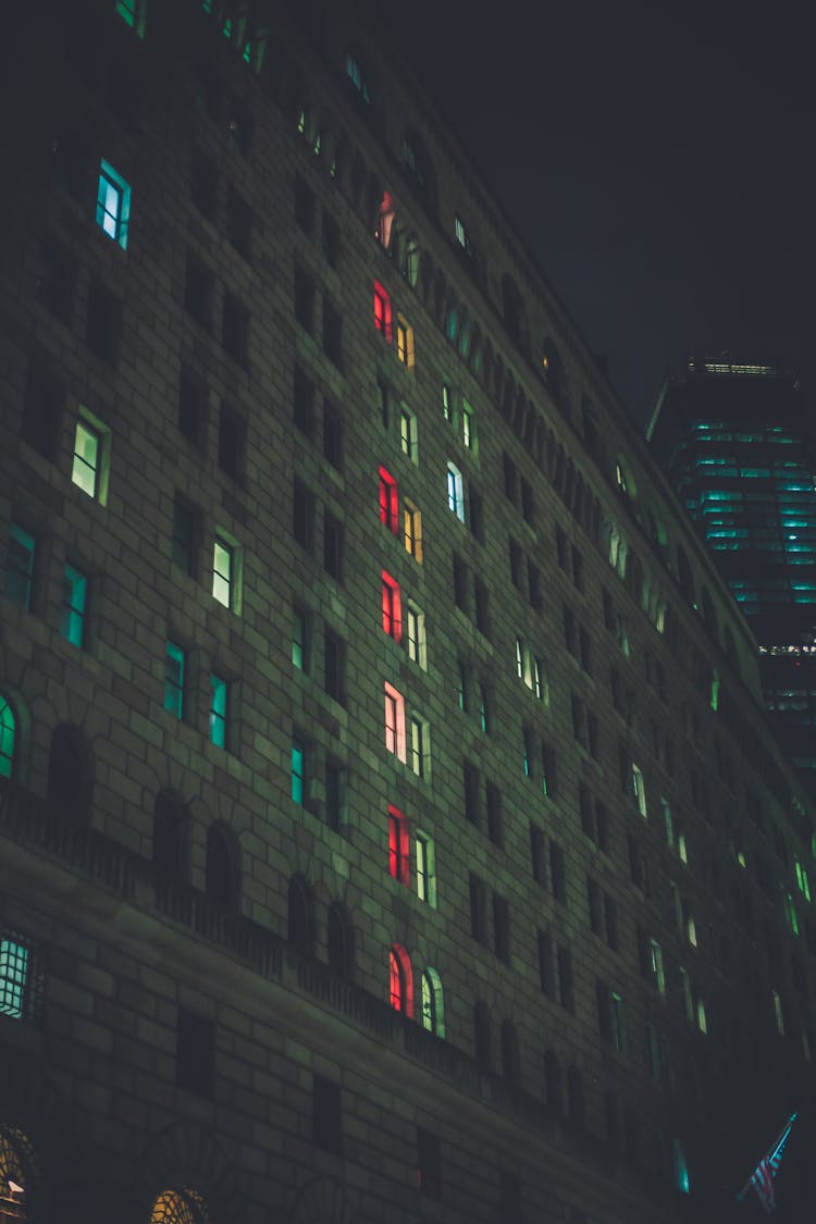 A View Of An Apartment Building At Night 