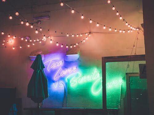 Free Neon Sign on the White Wall Stock Photo