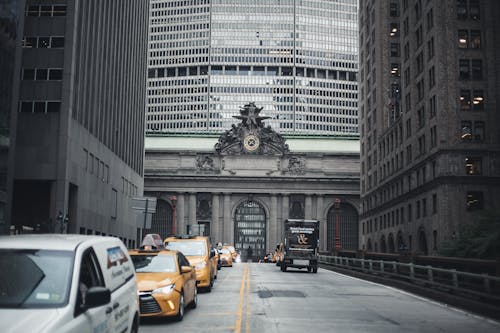 Free Cars on Road Near Building Stock Photo