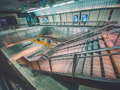 Staircases with Metal Hand Rails in a Subway Station