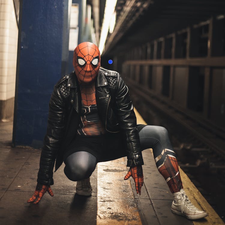 Man In Black Leather Jacket Wearing Spiderman Costume