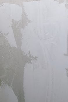 A minimalist grunge-style cement wall showcasing texture and subtle patterns.