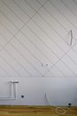 Pipes and wires on wall in room