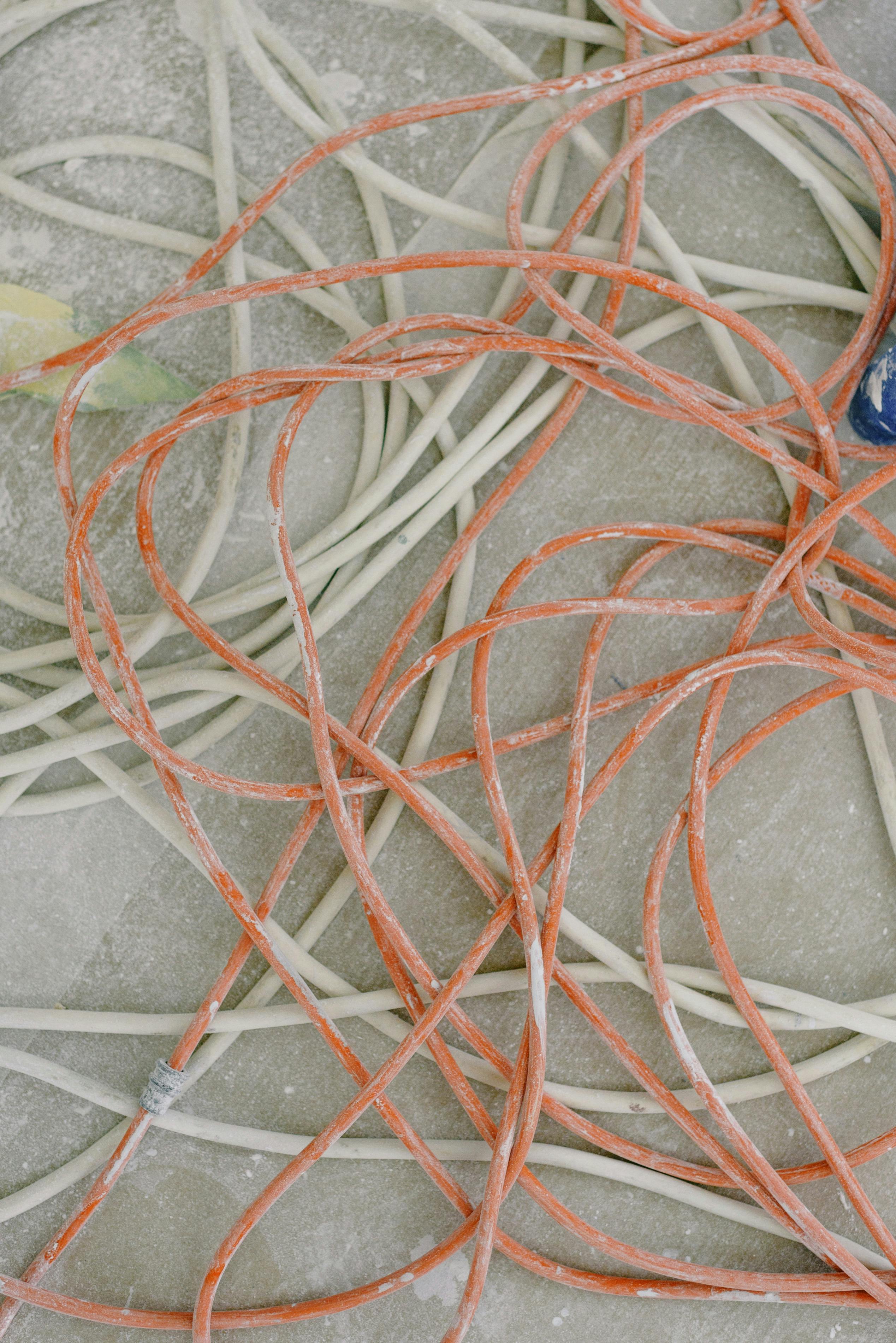 messy wires on floor in room