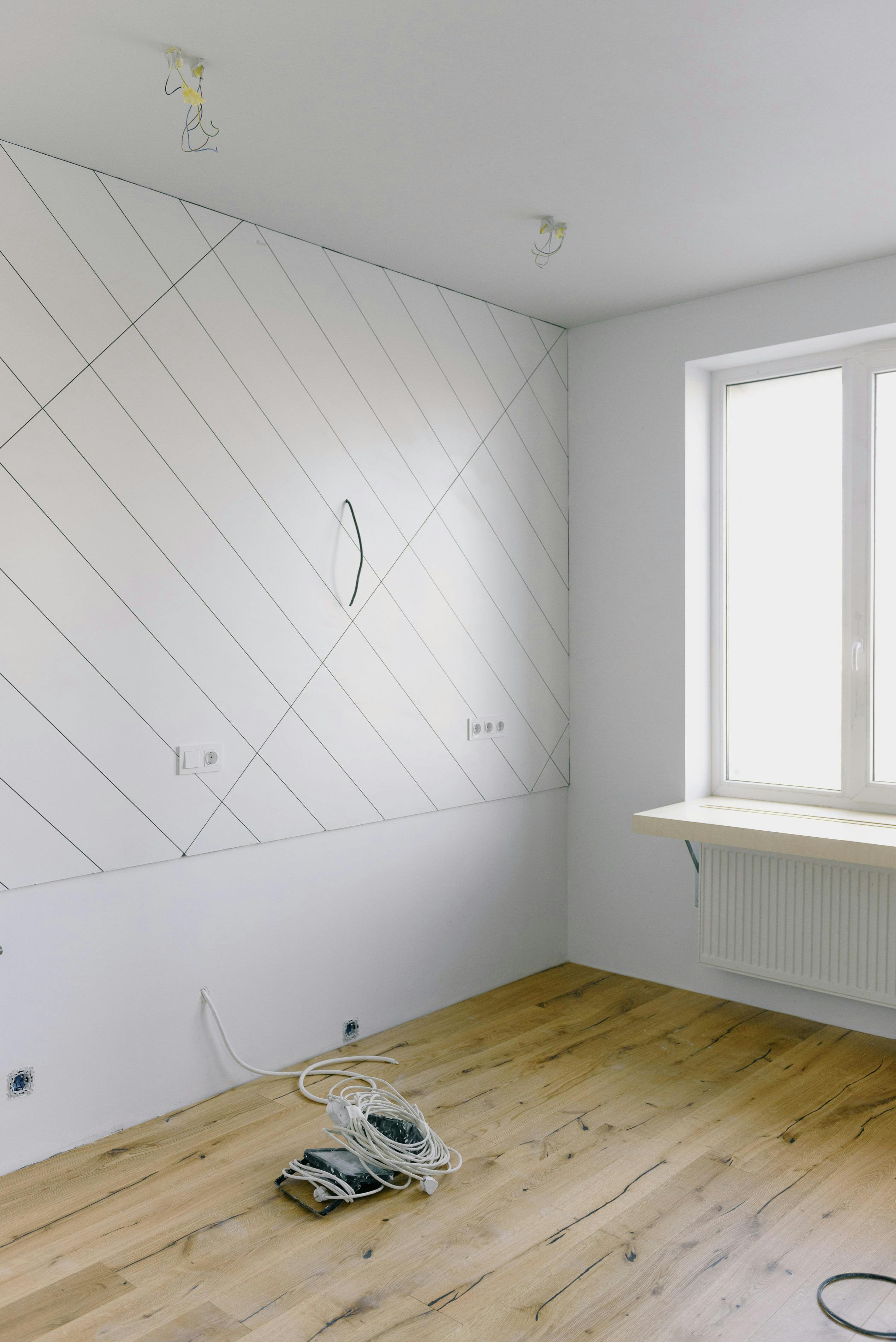 empty room with white walls and wooden floor