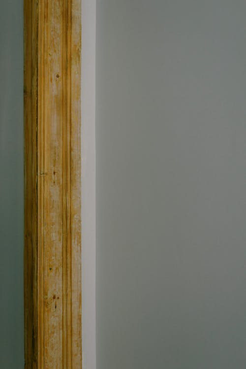 Wooden beam on window frame on gray background