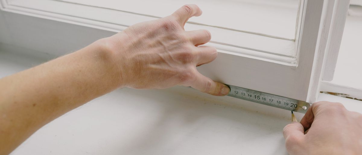 Weatherstripping installed around an exterior door frame