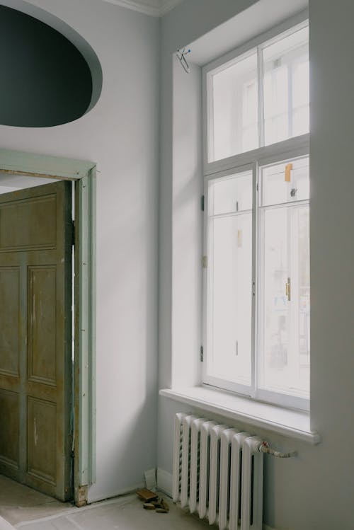 Shiny window above radiator in new apartment