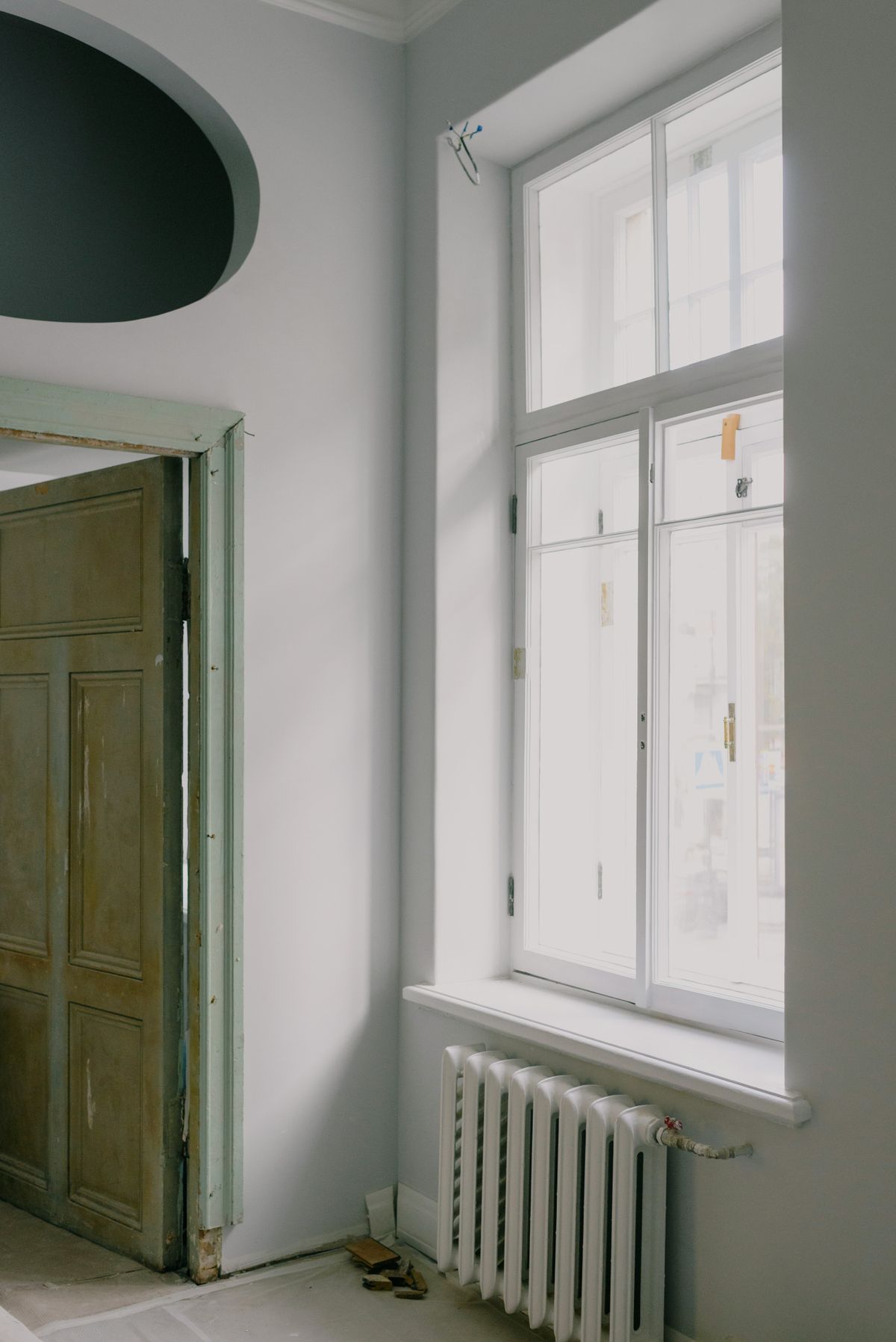 Radiator heating a bright residential interior