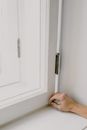 Person installing window in apartment