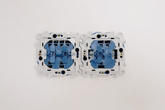 Detailed view of electrical sockets in a wall, ideal for renovation themes.