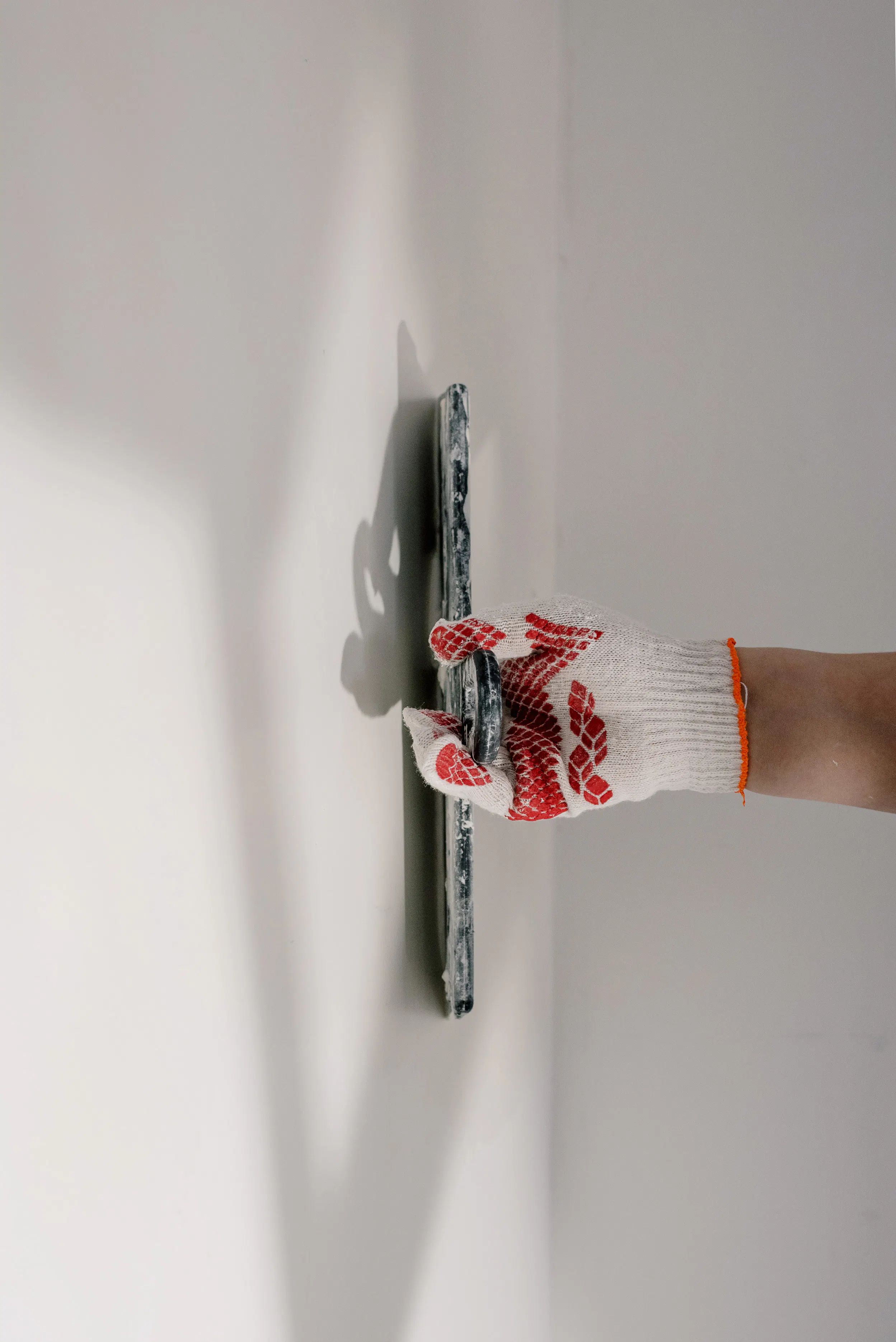 Female Nigerian shop owner arranging goods in provision store