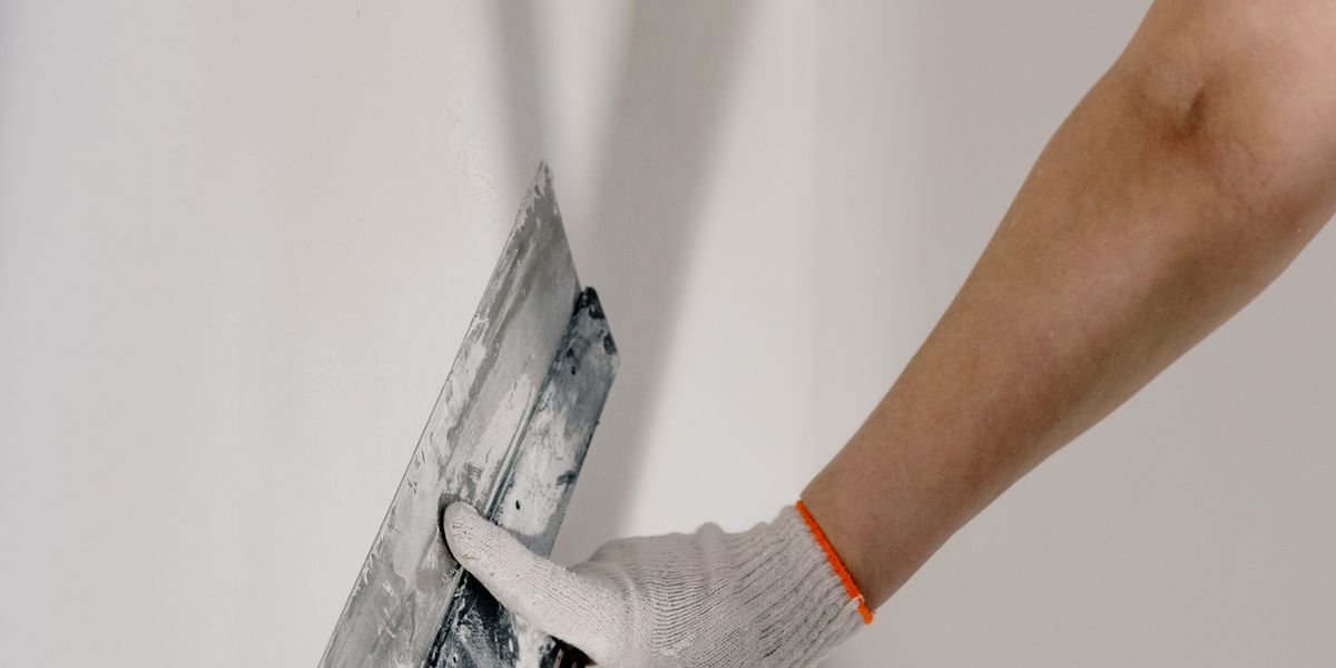 Pose de Gypse Montréal - Guide Complet pour Votre Projet 3 Various types of drywall panels stacked in warehouse