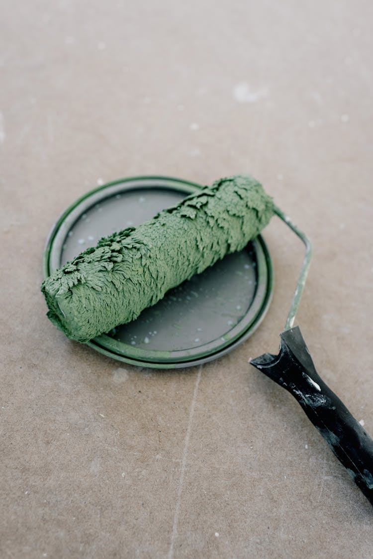 Paintbrush On Plastic Cap On Floor