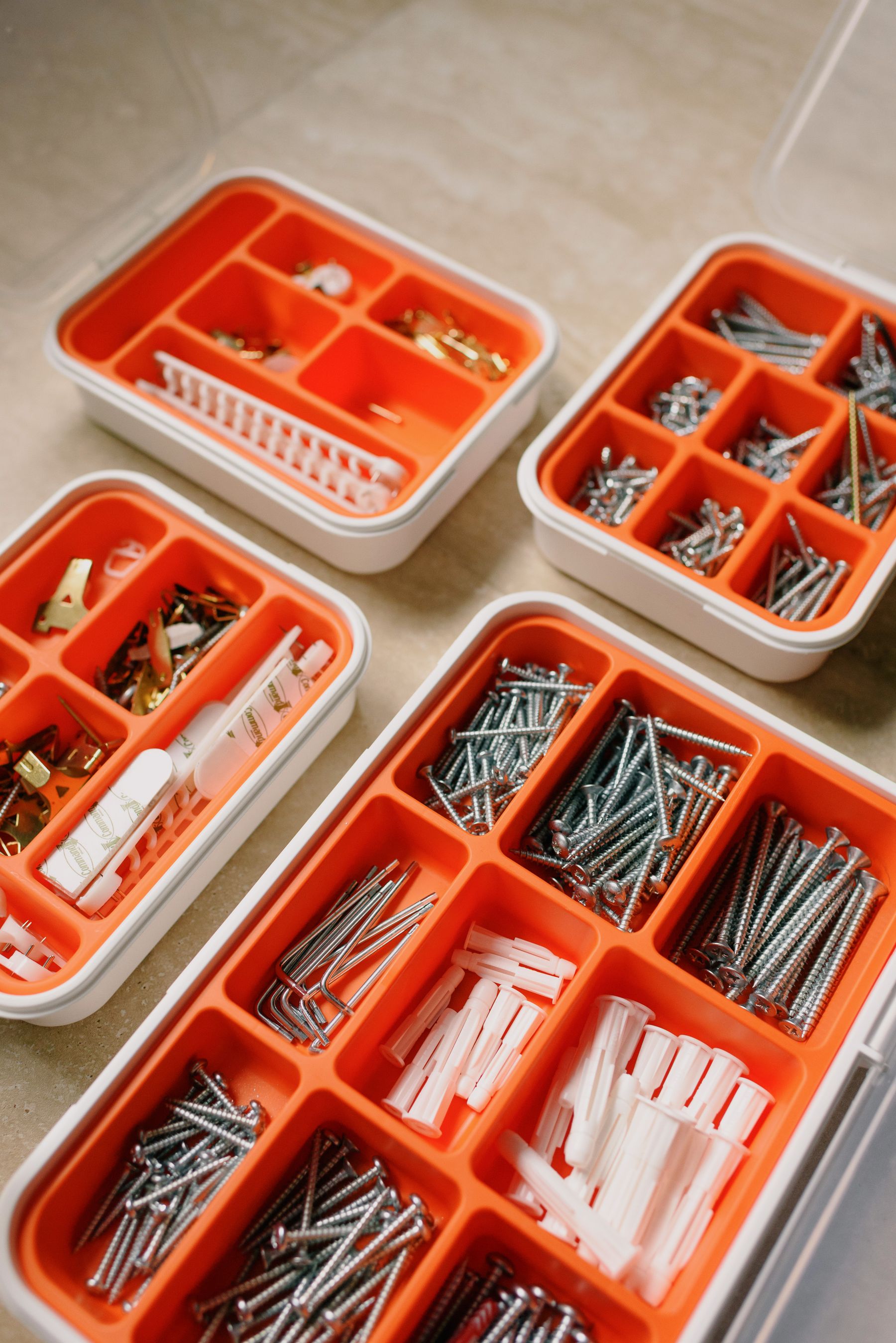Organized hardware and repair supplies arranged for inspection in a workshop