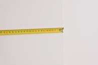 Measuring tape on empty white background