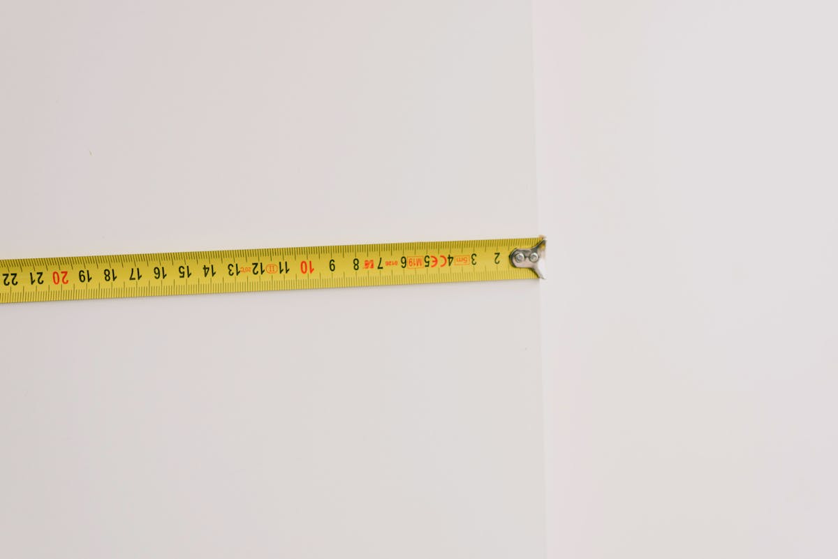 Measuring tape on empty white background