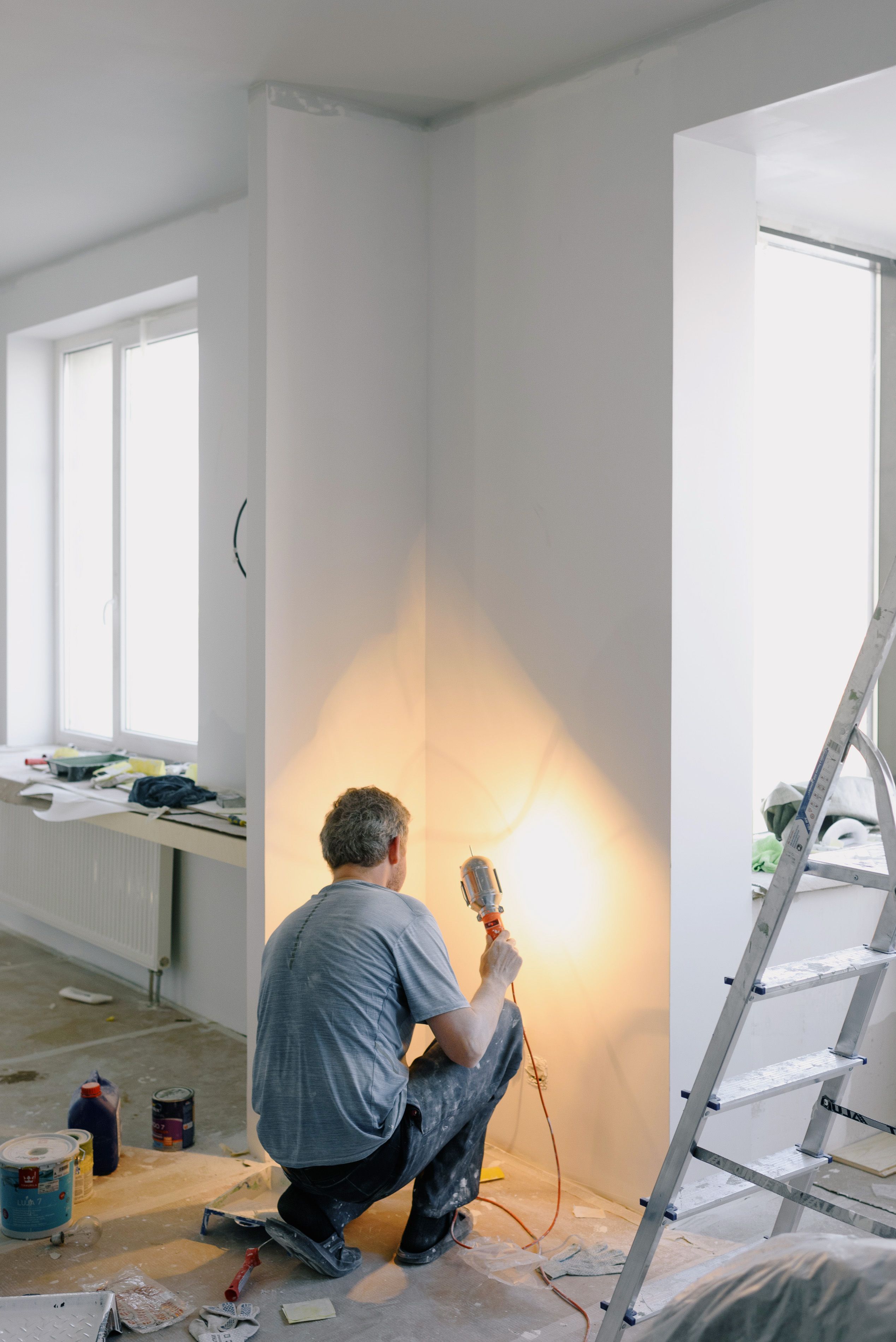 Contractor working inside a residential investment property during renovation