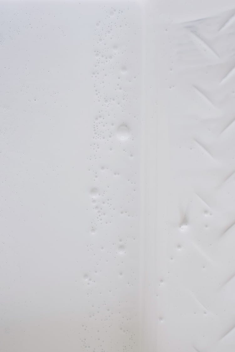 Uneven White Surface With Grains And Traces