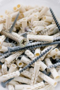Heap of wall dowels and screws