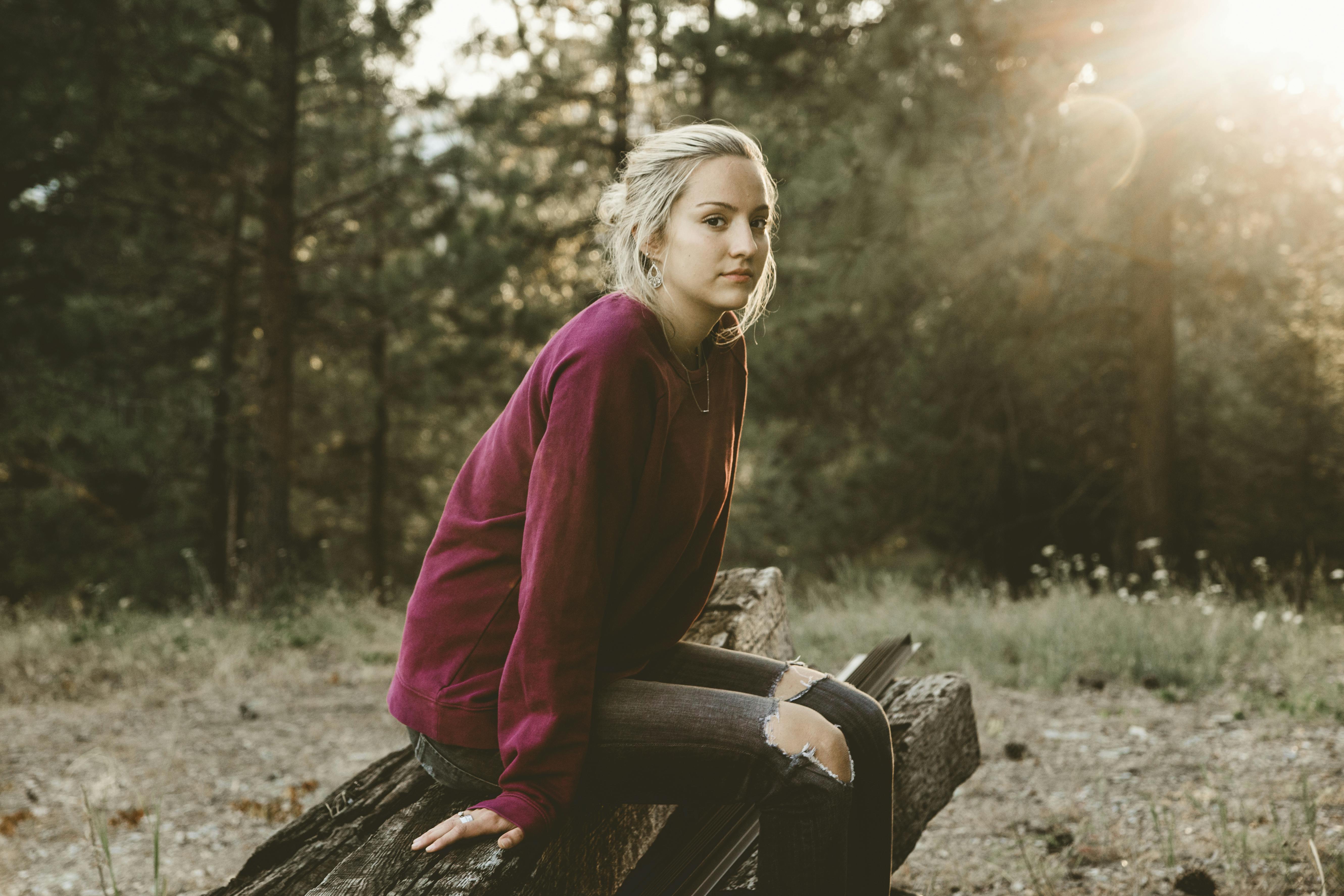 Woman Sitting on Drift Wood \u00b7 Free Stock Photo