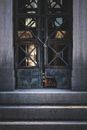 Old destructed wooden door of building with stone stairs