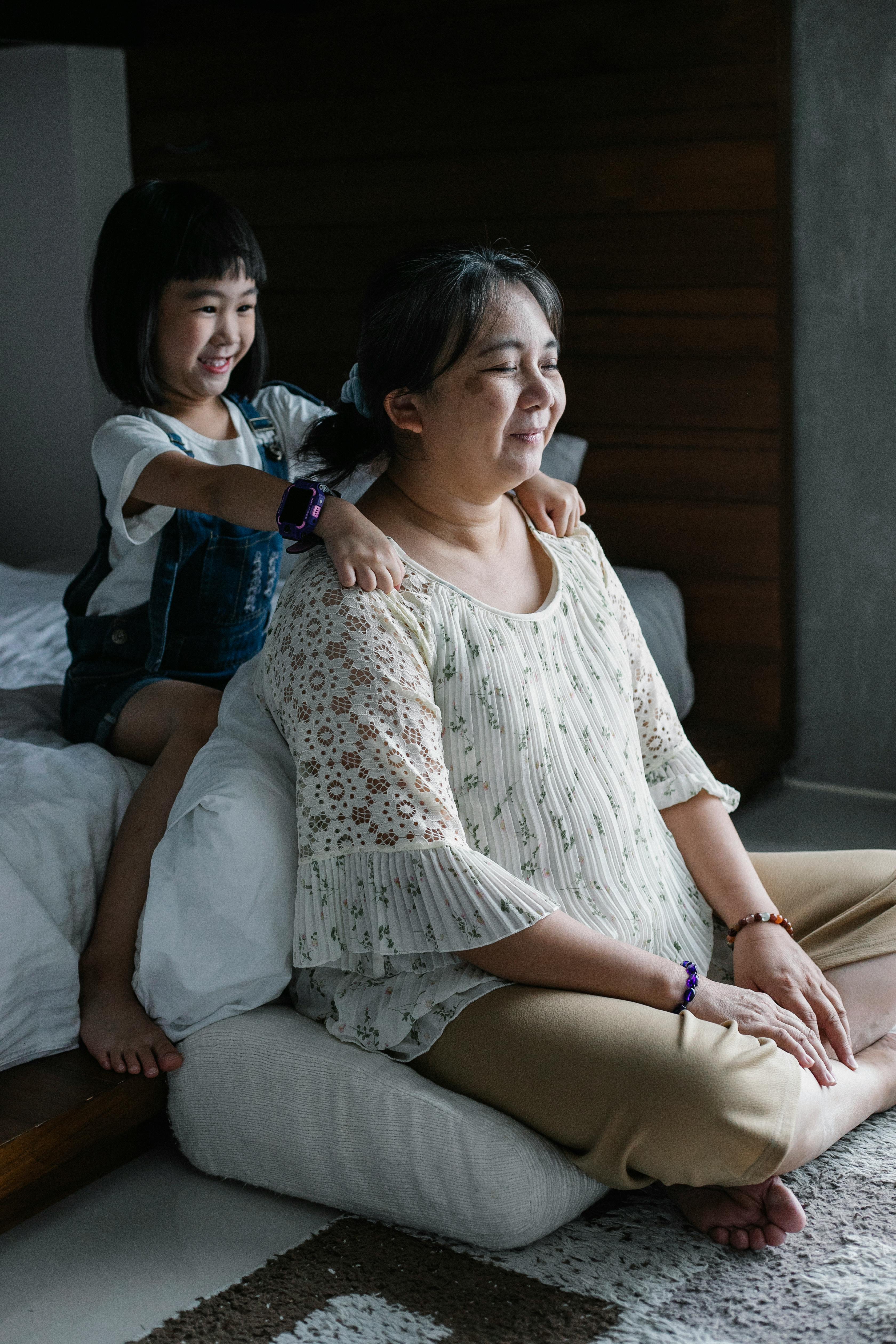 cheerful girl spending time with mother