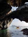 Person Riding on Yellow Kayak on Sea