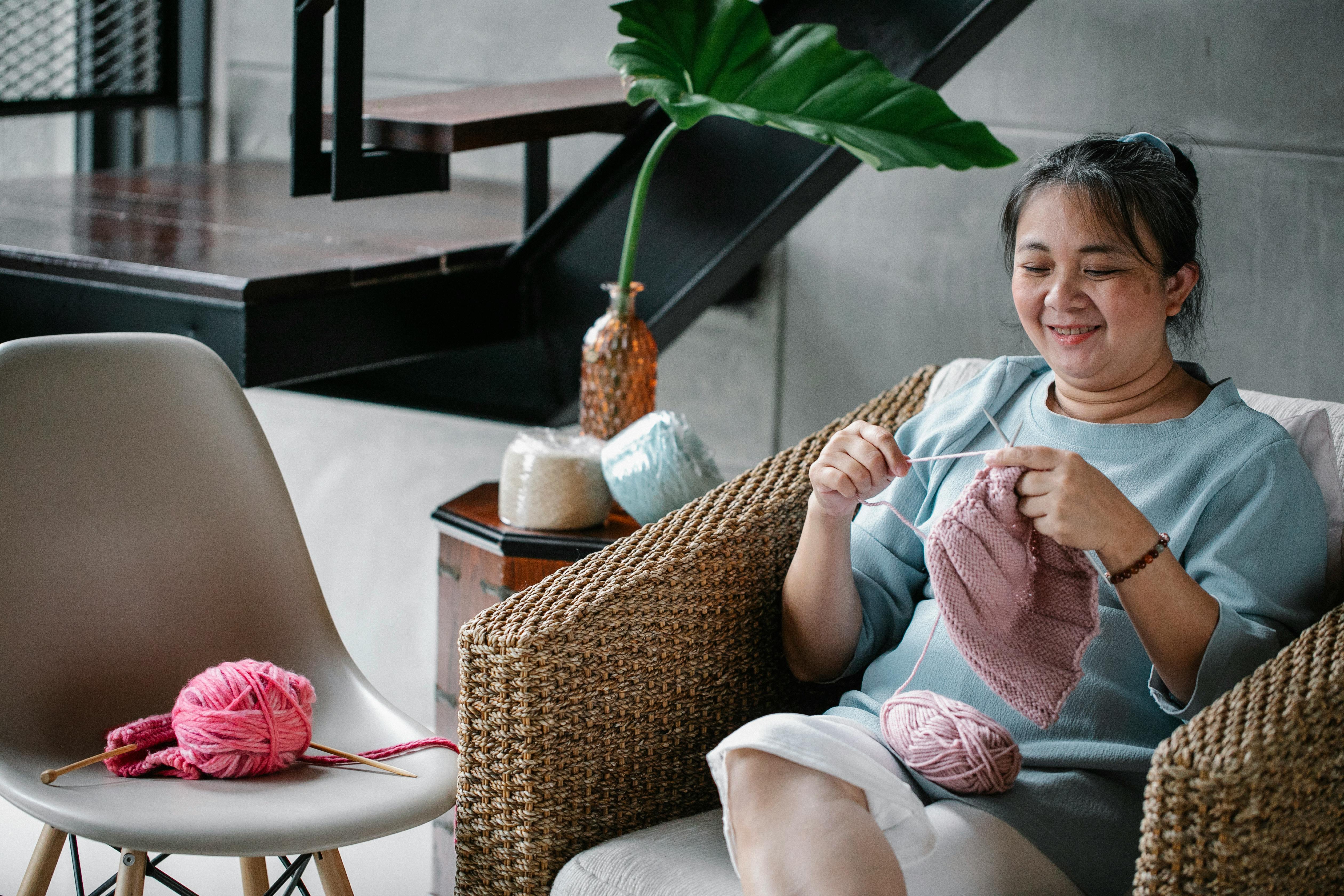 relaxed middle aged female knitting with needles