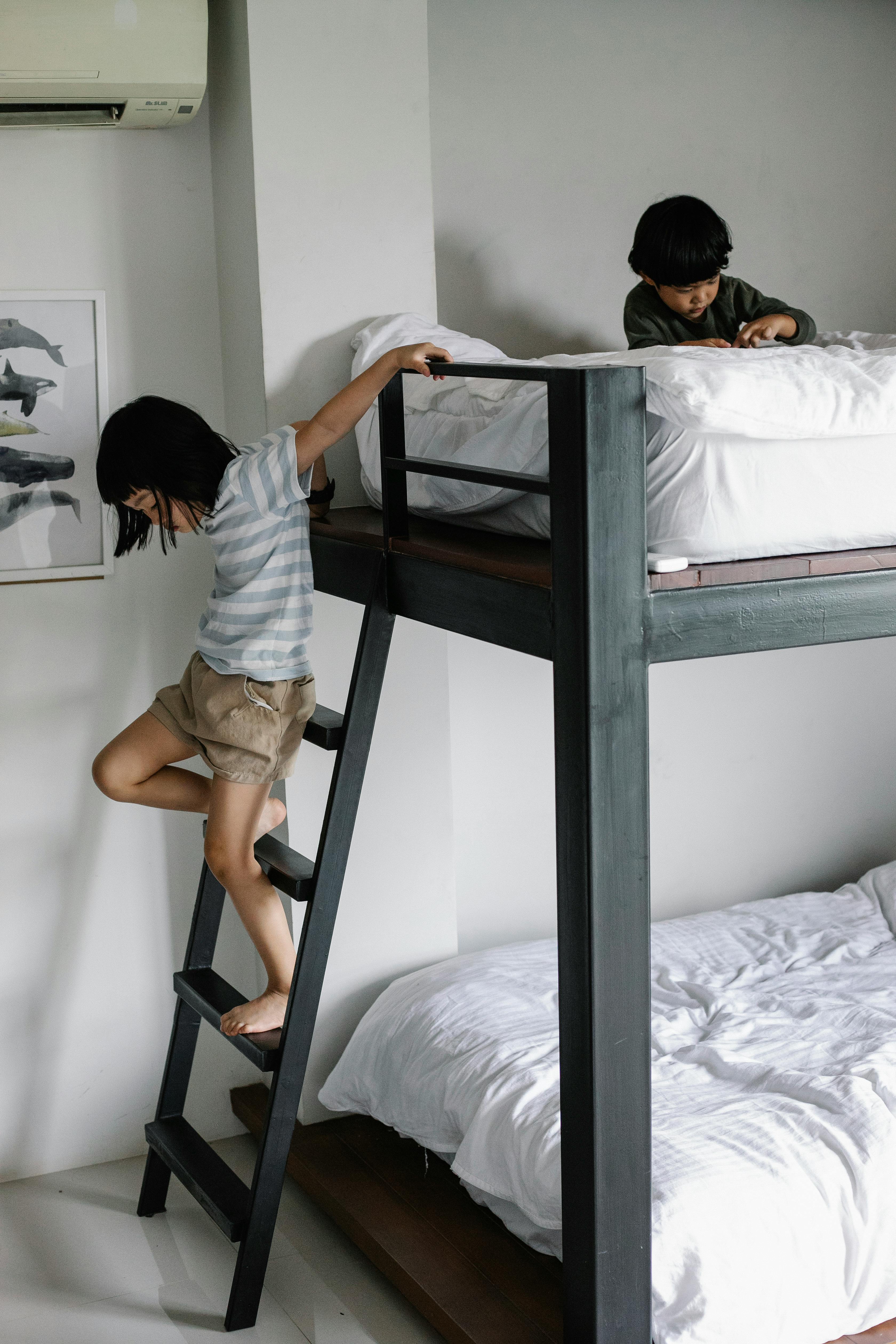 asian kids in bedroom with bunk bed