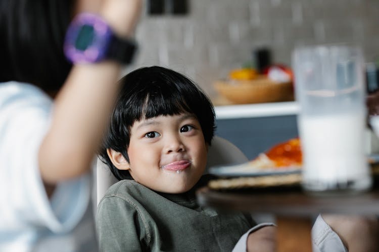 Positive Asian Boy Licking Lip