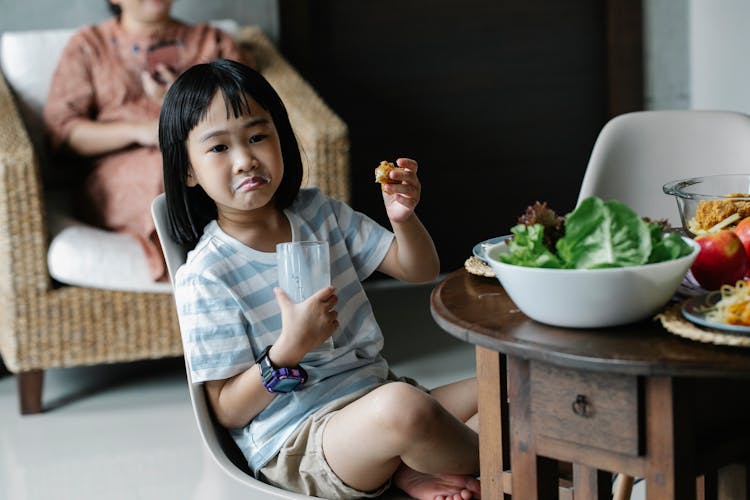 Asian Girl With Glass Of Milk